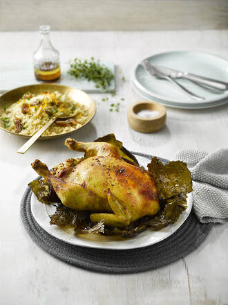 Roast Chicken With Vine Leaves & Pistachio Herb Stuffing